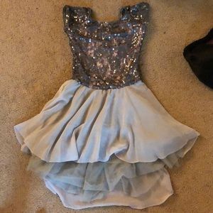 Light pick with lace and sequins. 5 layered skirt